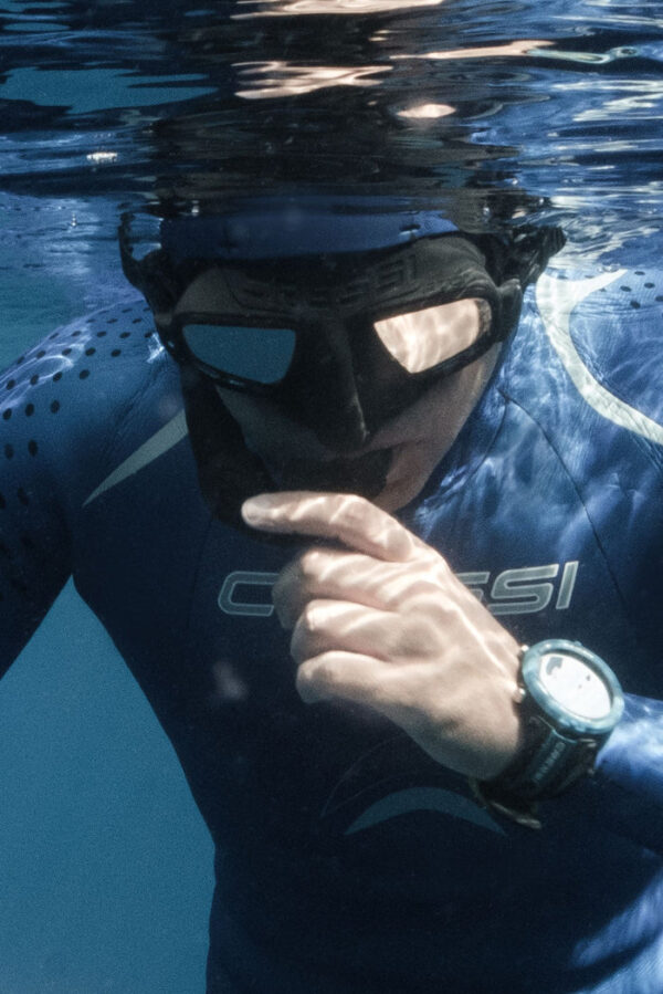 Atom Freediver in Water Holding Snorkel